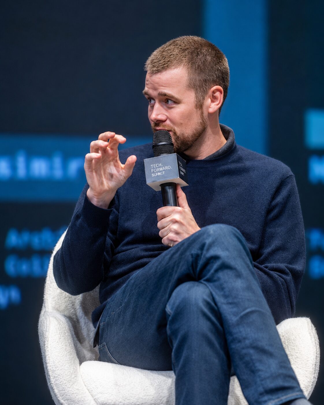 Casimir Esbach speaking on stage